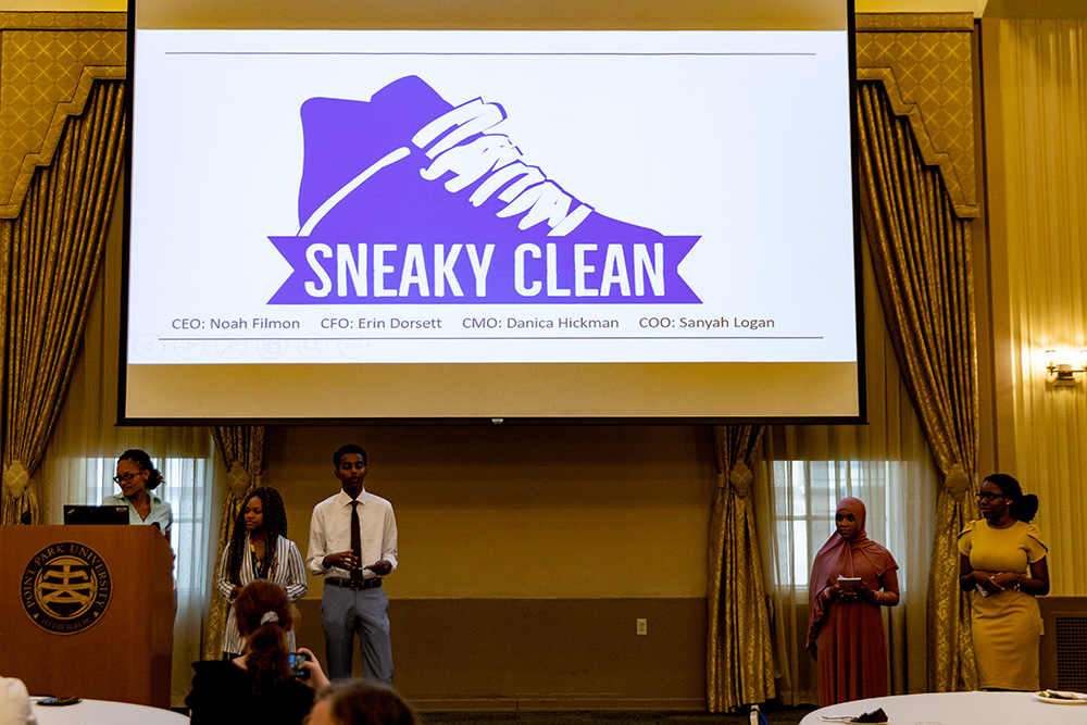 Students gave a presentation on Sneaky Clean, a cleaning company they developed during ACAP. Photo by John Altdorfer.