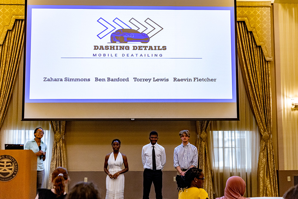 Students deliver a presentation on Dashing Details, the mobile detailing business they developed during ACAP. Photo by John Altdorfer.