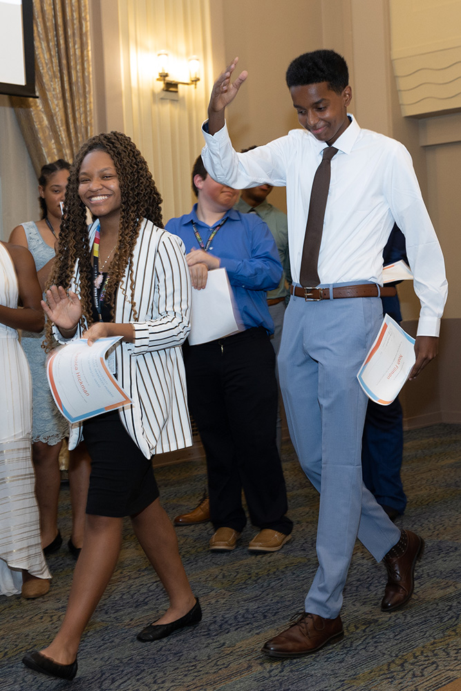 ACAP students celebrate after receiving their certificates of completion at the closing ceremony. Photo by John Altdorfer.