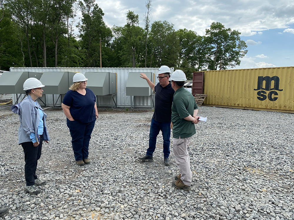 After touring a coal mine site from which Stronghold sources its fuel, Kit Mueller gave Rowland School of Business faculty a tour of the company's Scrubgrass Power Plant, where hundreds of machines mine for Bitcoin.