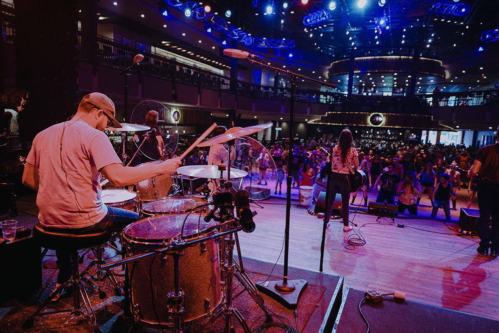 Pictured is Evan Pearson playing drums at a live concert. Submitted photo.