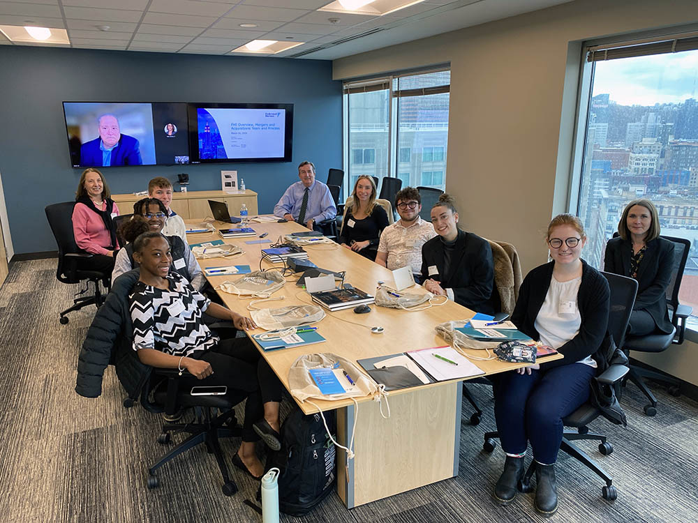 Pictured are Point Park students and Professor Jayne Olshanski in a conference room at Federated Hermes. Photo by Nicole Chynoweth.