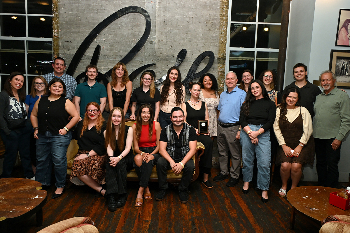 Students pose for a photo at the Gibson Garage in Nashville, Tennessee. 