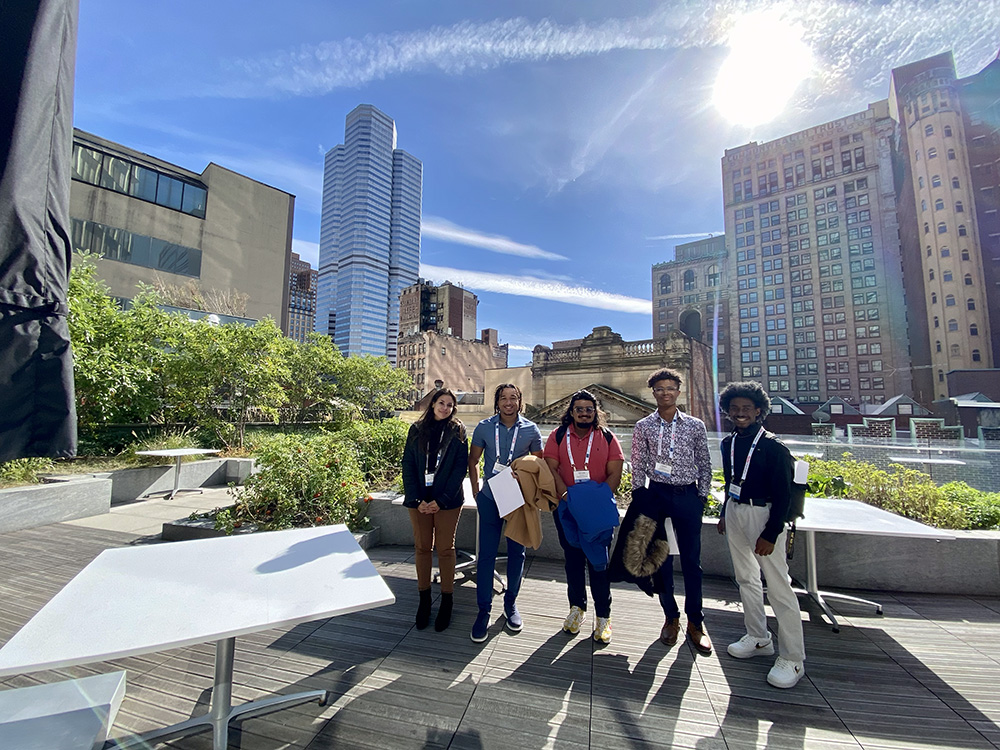 Natalie Diaz-Molina, Edwin De La Rose, Shivansh Waleacha, Matthew Harris and Terry Craig Jr. pose for a photo on the terrace at the Tower at PNC Plaza.