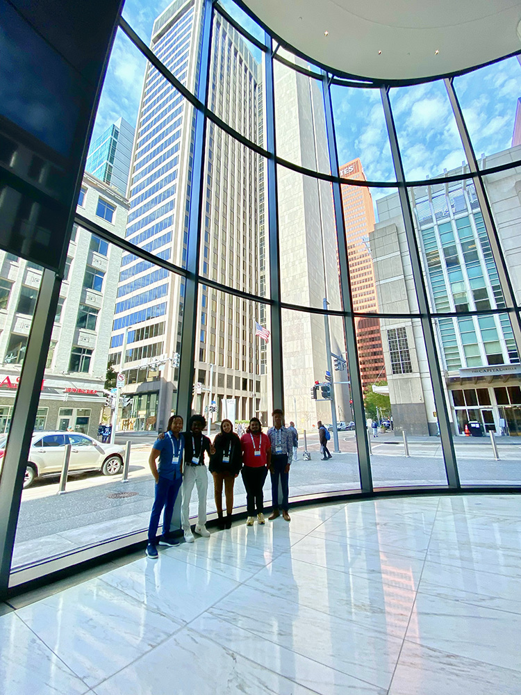 Edwin De La Rosa, Terry Craig Jr., Natalie Diaz-Molina, Shivansh Waleacha and Matthew Harris pose for a photo inside the Tower at PNC Plaza. Photo by Nicole Chynoweth.