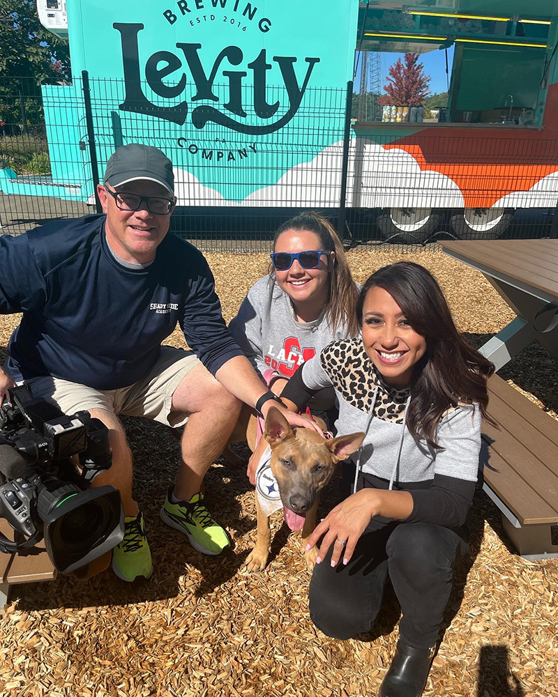 Lacey Muto, center, poses for a photo with KDKA videographer Jeff Roupe and host Daisy Jade. Photo by Teddy Stevenson.