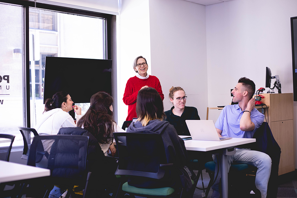 Pictured is Professor Paige Beal interacting with students in the Principles of Marketing course. Photo by Madi Fisher. 