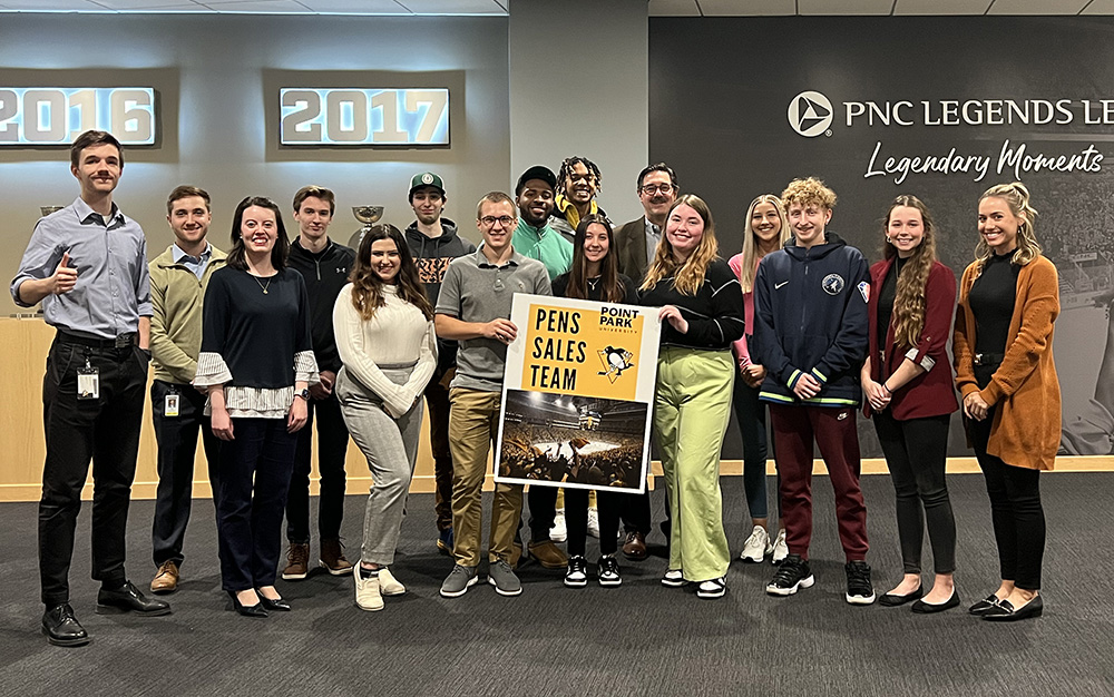 Pictured are Point Park University students from the Pittsburgh Penguins sales team and Professor Robert Derda. Submitted photo. 