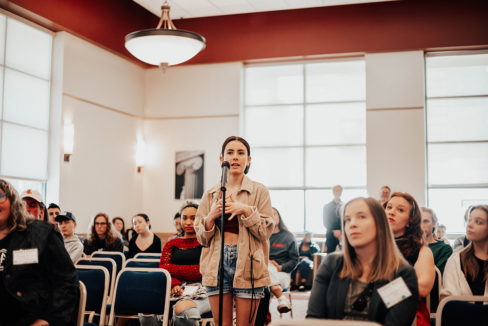 Pictured is a student posing a question to panelists at the Emerging Trends in SAEM panel. Photo by Madi Fisher.