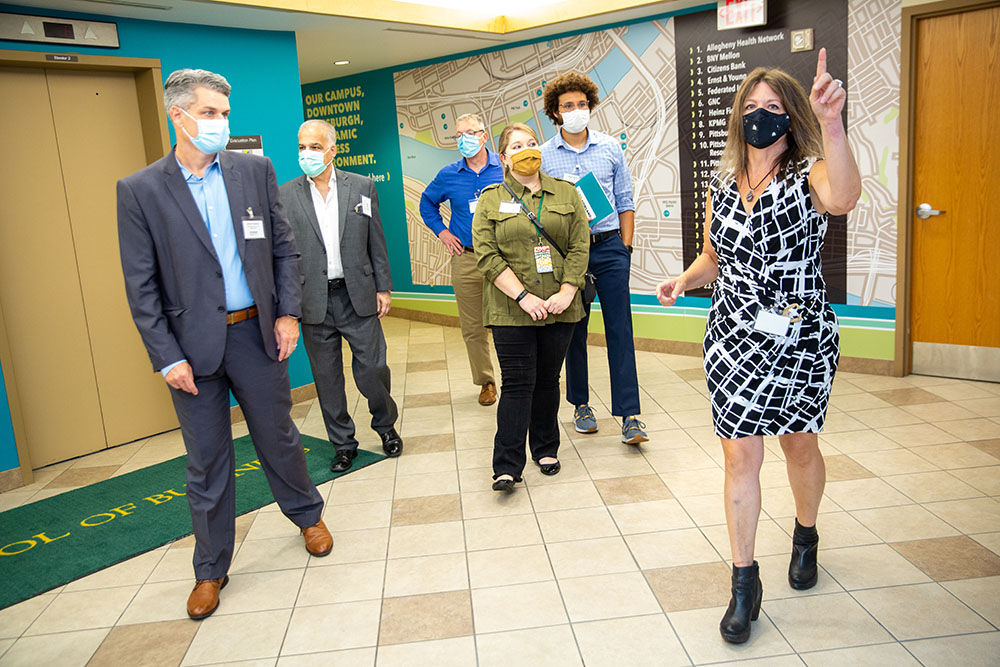 Associate Professor Dorene Ciletti takes event attendees on a tour of the new Michael P. Pitterich Sales and Innovation Center. Photos by  John Altdorfer.