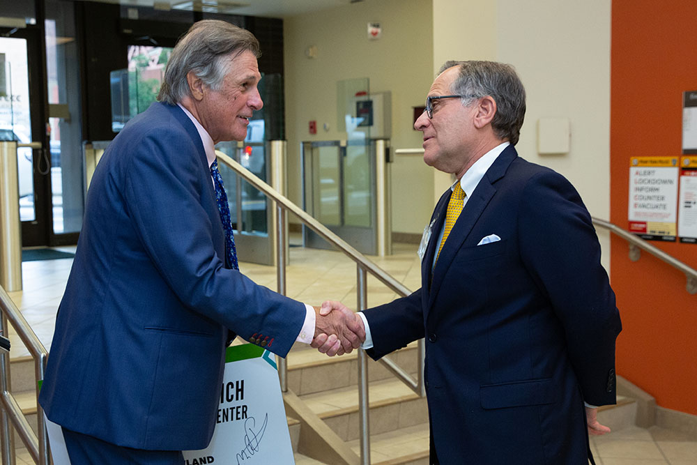 Michael P. Pitterich, left, shakes hands with Board of Trustees Chairman Joseph. R. Greco, Jr. Photos by  John Altdorfer.