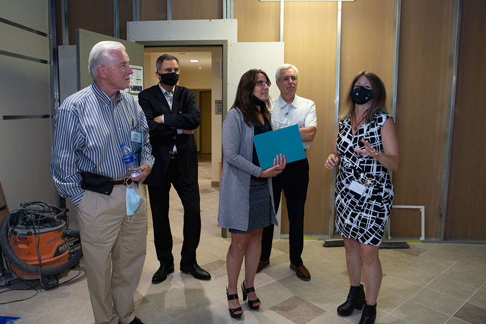 Associate Professor Dorene Ciletti takes event attendees on a tour of the new Michael P. Pitterich Sales and Innovation Center. Photos by  John Altdorfer.