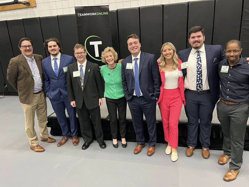 Pictured are Professor Robert Derda, Korry Myers, Jacob Palmer, TeamWork Online Founder Buffy Filippell, Chris Vaughn, Mathew Fitzmaurice and Brandon Cunningham.