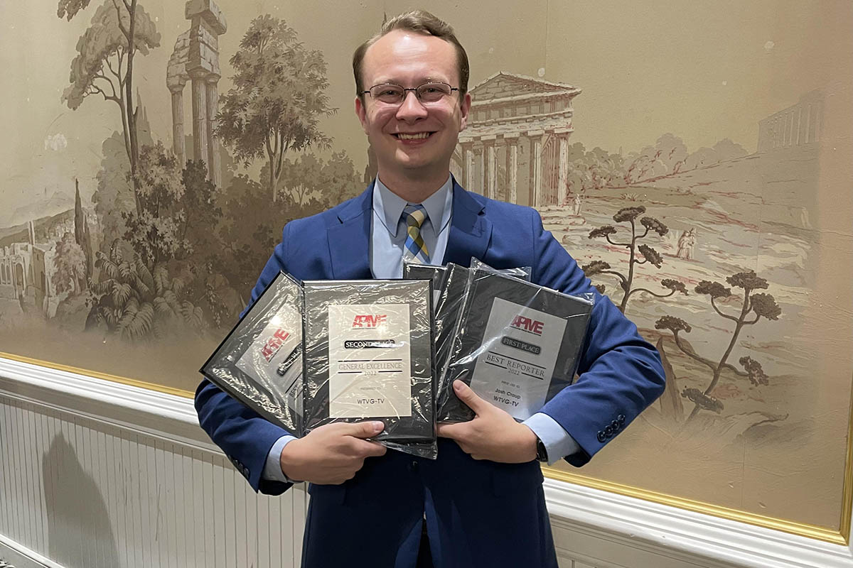 Josh Croup with awards from the Ohio Associated Press ceremony.