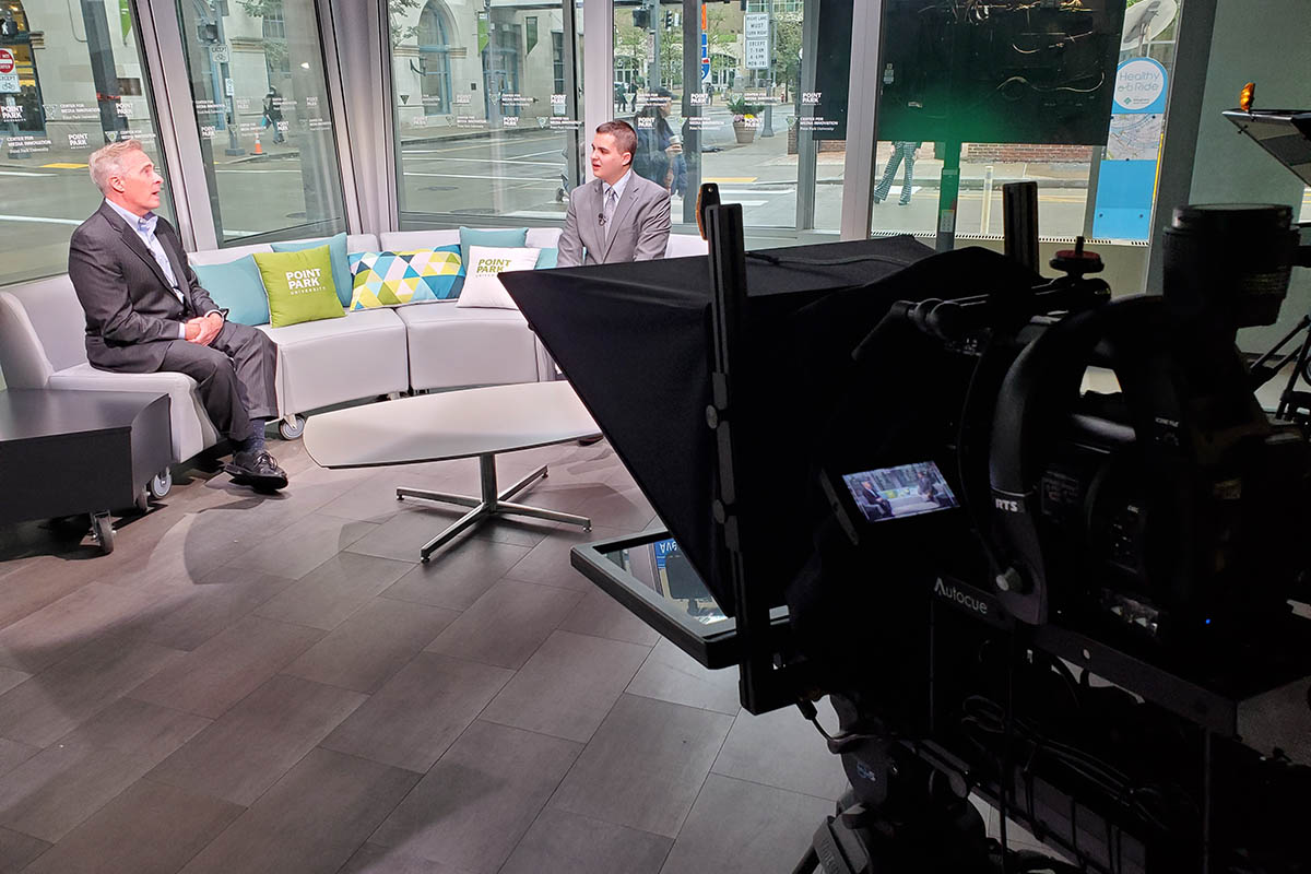 Student Colton DeBiase interviews Point Park University President Paul Hennigan as part of a segment for election night coverage.  Photo | Stacey Federoff