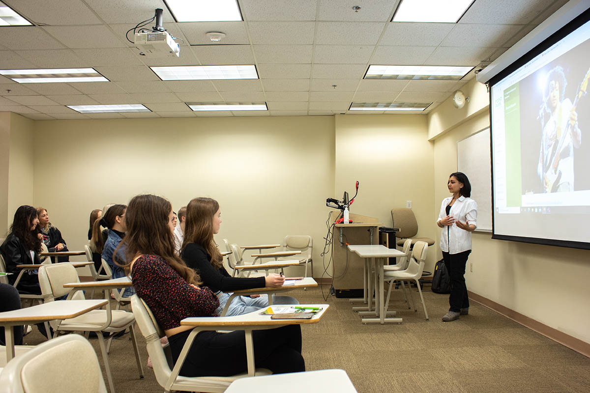 SAEM & broadcasting major Sandamini Sinley talks to students about Pioneer Records, the student-run record label. Photo | Natalie Caine