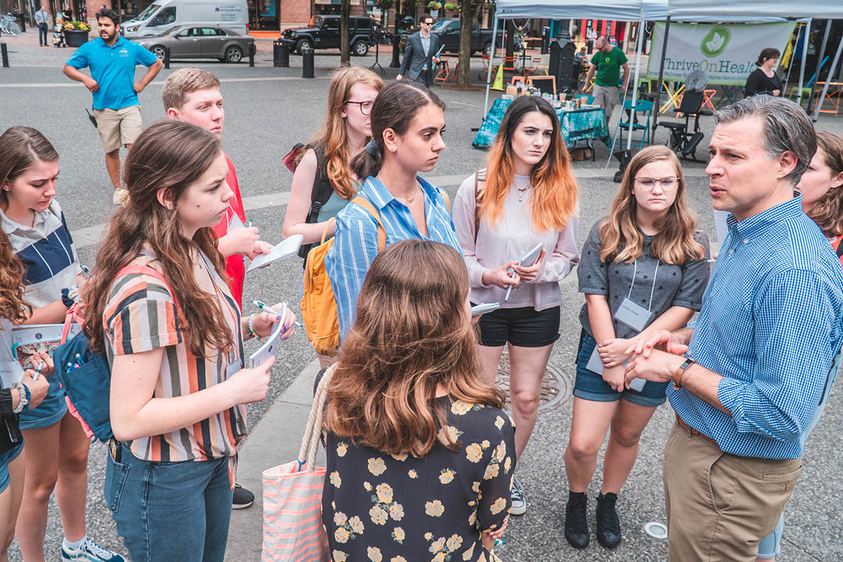 Students in Market Square with Andrew Conte, director of Point Park's Center for Media Innovation. Photo | Emma Federkeil