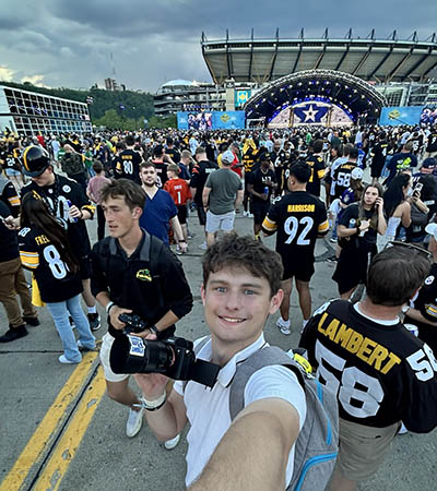 Sports communication major photographs the 2026 NFL Draft in Downtown Pittsburgh.