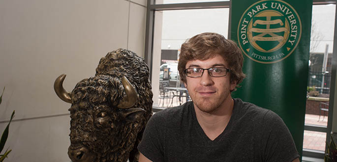 Pictured is School of Communication graduate student Brandon Gdula. Photo | Christopher Rolinson