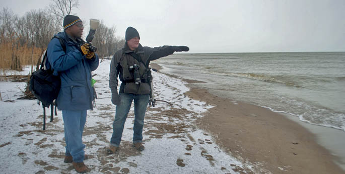 Associate Professor Christopher Rolinson leads students on a field trip to Presque Isle State Park as part of his Nature Photography special topics course during spring semester 2012. | Photo by Leah Irwin