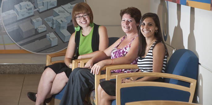 School of Communication alumni, from left, Stephanie Rex, Amanda Gillooly and Heidi Dezayas in Academic Hall. | Photo by Chris Rolinson