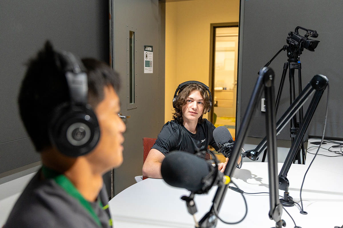 Students host a podcast in the Center for Media Innovation. Photo | Paul Koontz