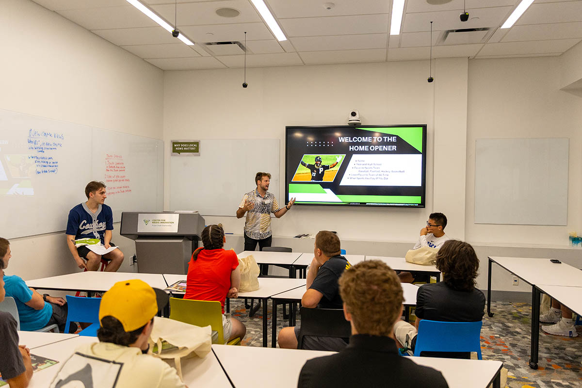 Alumnus Kyle Archer, enrollment outreach coordinator for the School of Communication, leads a session in the Center for Media Innovation. Photo | Paul Koontz