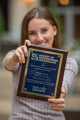 Pictured is Nikole Kost with her Mark of Excellence Award. Photo | Nick Koehler.