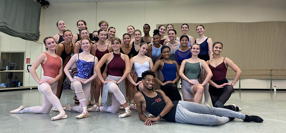 Pictured is Addison Ector with Point Park University dance students. 