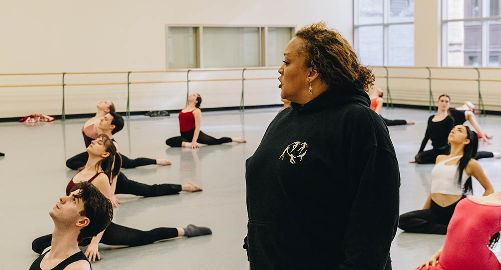 Pictured is Kiki Lucas leading a warmup in the George Rowland White Performance Center. Photo | Ethan Stoner