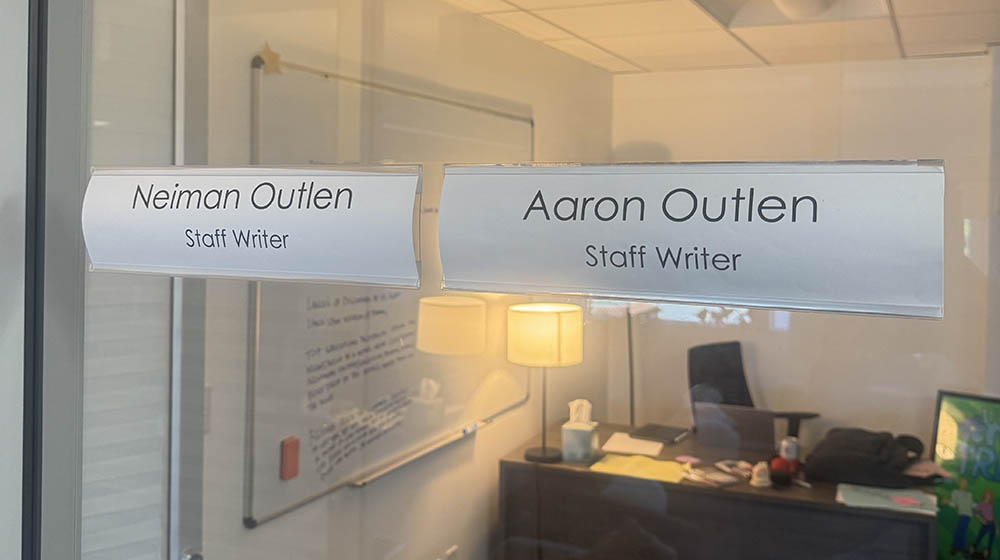 Aaron and Neiman Outlen's names outside of their office at ABC.