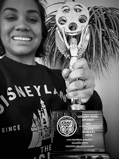 Pictured is Ailene Roberts with the Golden Reel Award.