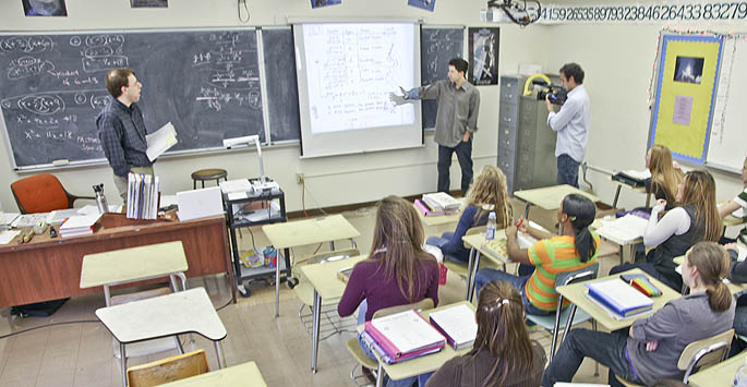 Cinema graduate Kevin Kauffman films ESPN writer Todd Gallagher for a documentary on Gallagher's return to high school. | Photo by Andrew Weier