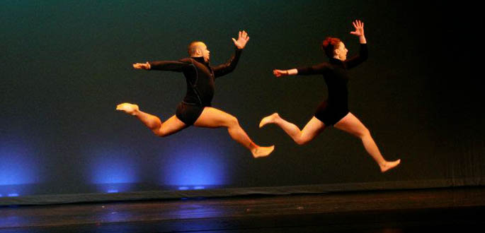 Dance alumni James A. Washington and Annalee Traylor perform for youth in South America. Photo | Cassie Kay Rusnak.