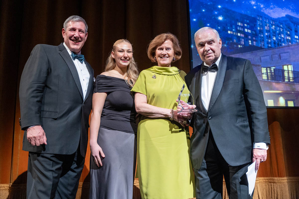 Dennis and Annie Cestra accepting the Leading Player Award. Photo | John Altdorfer