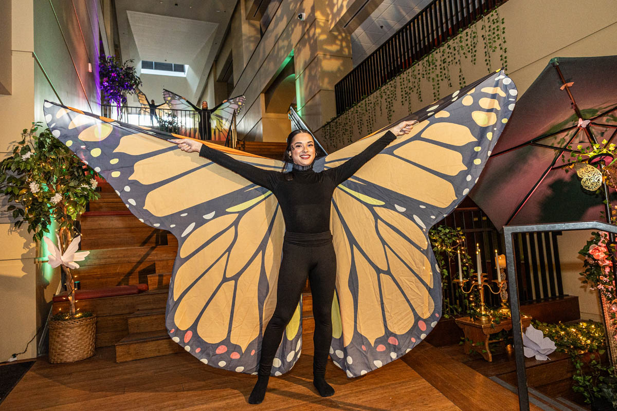 Point Park students dressed as butterflies in the lobby during the opening reception. Photo | John Altdorfer