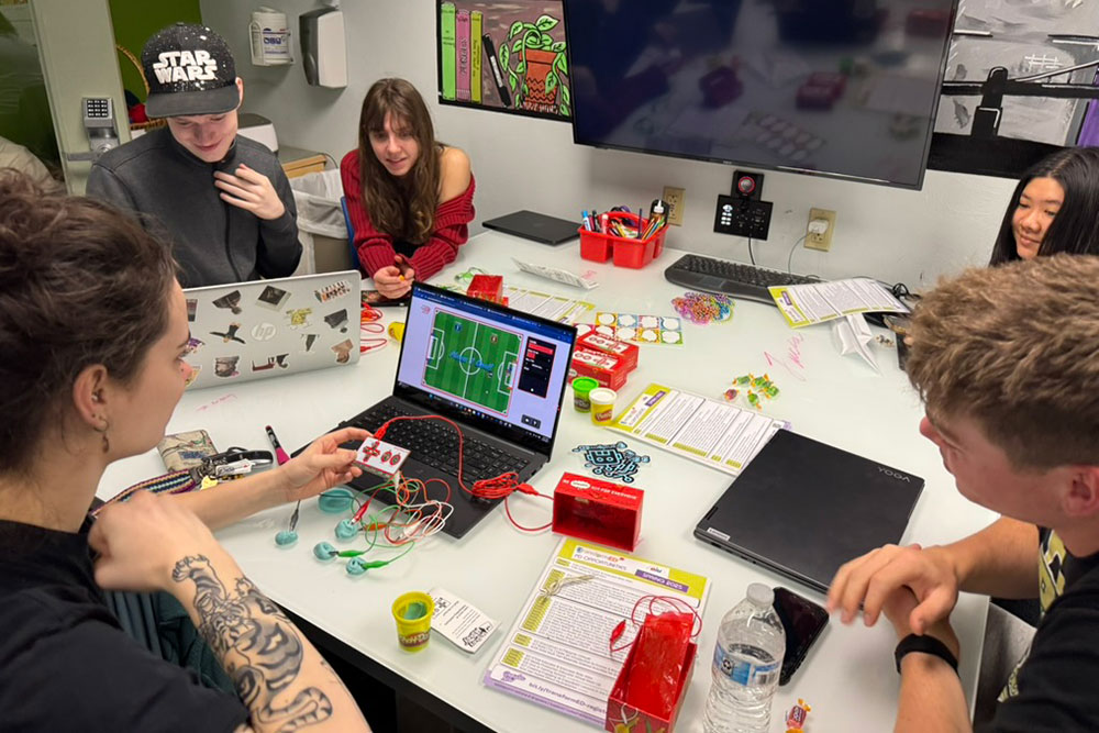 Students engage in an activity in the Maker Space.