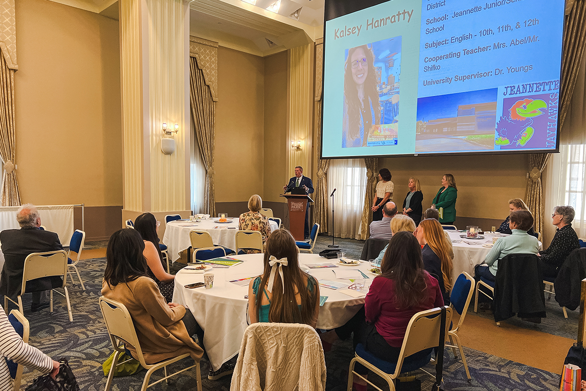 Pictured is President Chris Brussalis speaking at the Celebration of Student Teaching. Photo by Nadia Jones.