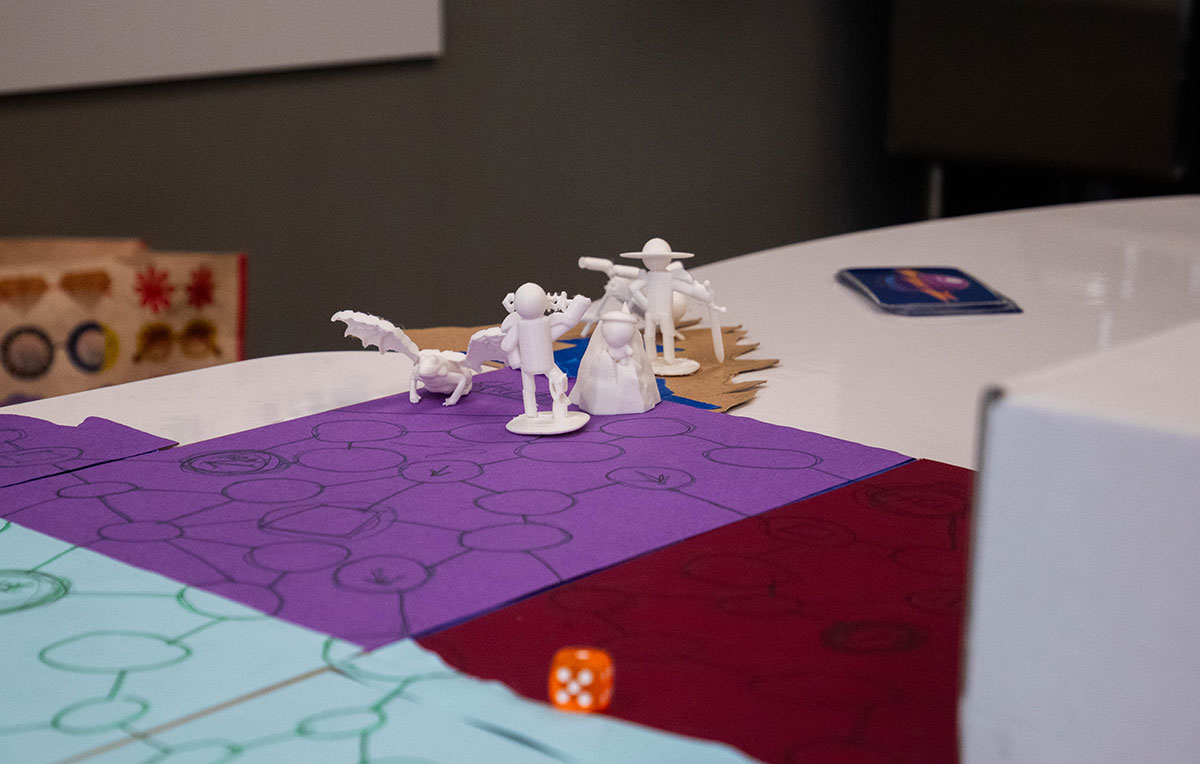 A close up photo of 3D printed board game characters.