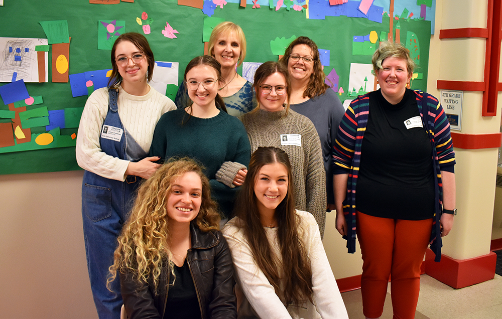 Pictured are Professor Christal Edmunds and Point Park students at Foster Elementary School. Photo by Nicole Chynoweth.