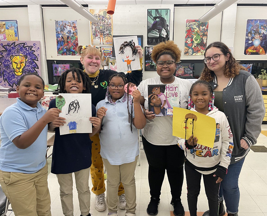 Point Park University students pose for a photo with Pittsburgh Faison students after facilitating a mini-lesson. The field experience was part of Point Park's Family and Community Diversity course. Submitted photo.