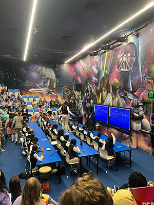 Ron Clark stands on a table as he teaches. 