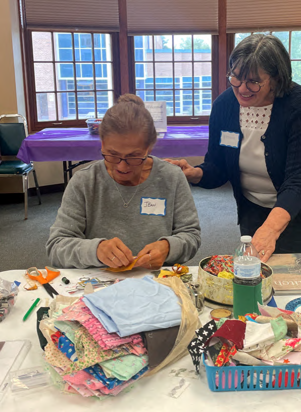 Pictured is Vincenne Revilla Beltran instructing an attendee at one of her handstitching workshops. Submitted photo.