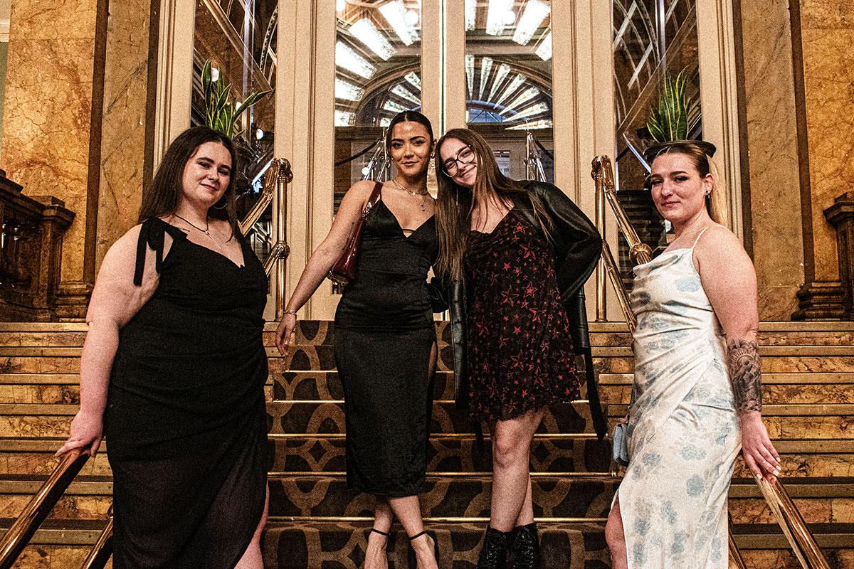 Student pose on the stairs at the Grand Concourse.