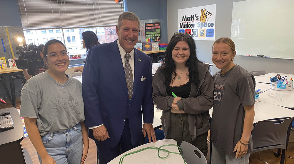 President Brussalis with students in Matt's Maker Space Two. 