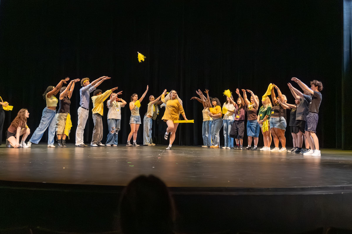 Students perform on stage during the lip sync battle.
