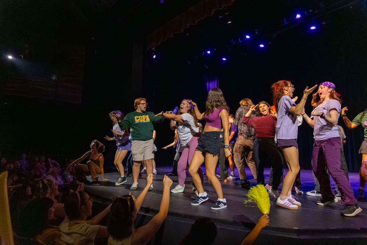 Students perform on stage. 