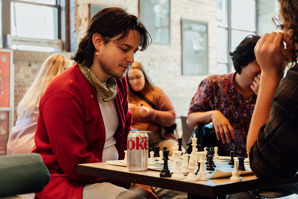 A student plays chess.