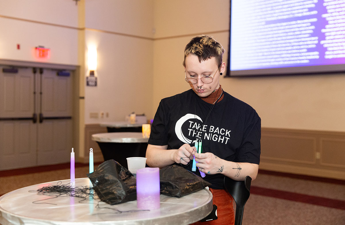 A student works on a project at a hightop table