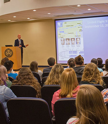 Point Park alumnus Tom McMillan, vice president of communication for the Pittsburgh Penguins and co-founder of the Pittsburgh Center for Sports Media and Marketing, gives a presentation on Flight 93 as part of Point Park's 9/11 observances on Sept. 11, 2014. | Photo by Victoria A. Mikula